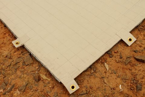grommet holes at corner of cricket mat by The Mat King